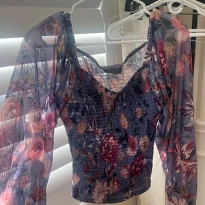 Anthropologie long sleeve flowy sleeve top. Bodice is a snug fit